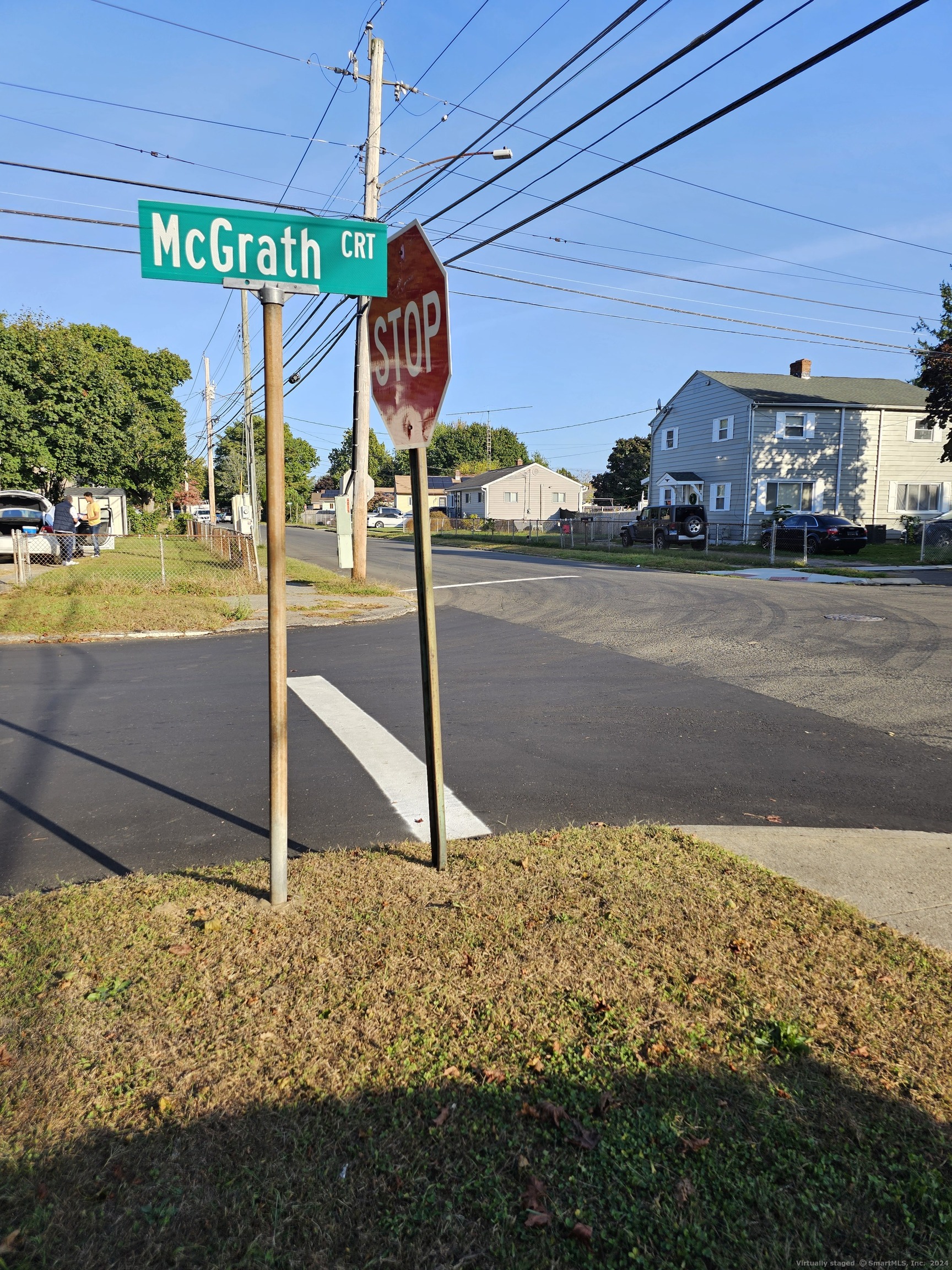 a view of a street with sign board