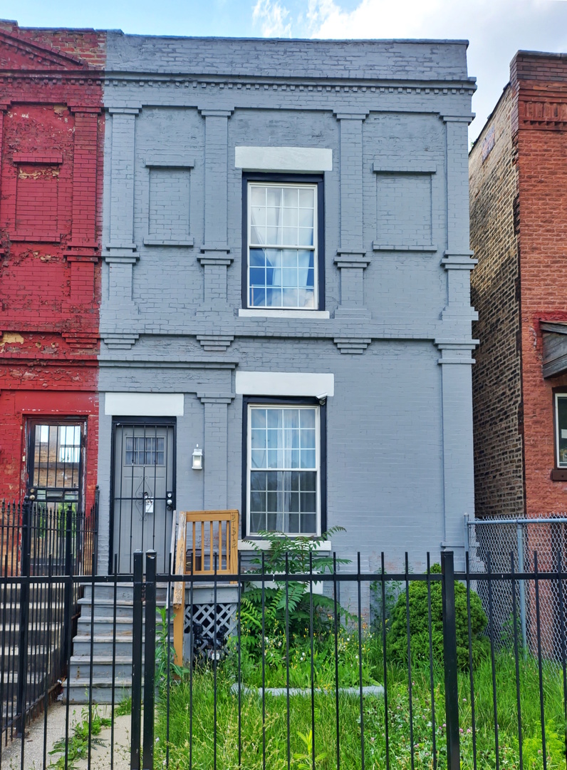 front view of a house with a small yard