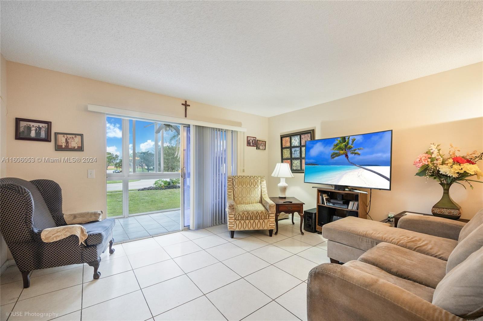 a living room with furniture and a flat screen tv