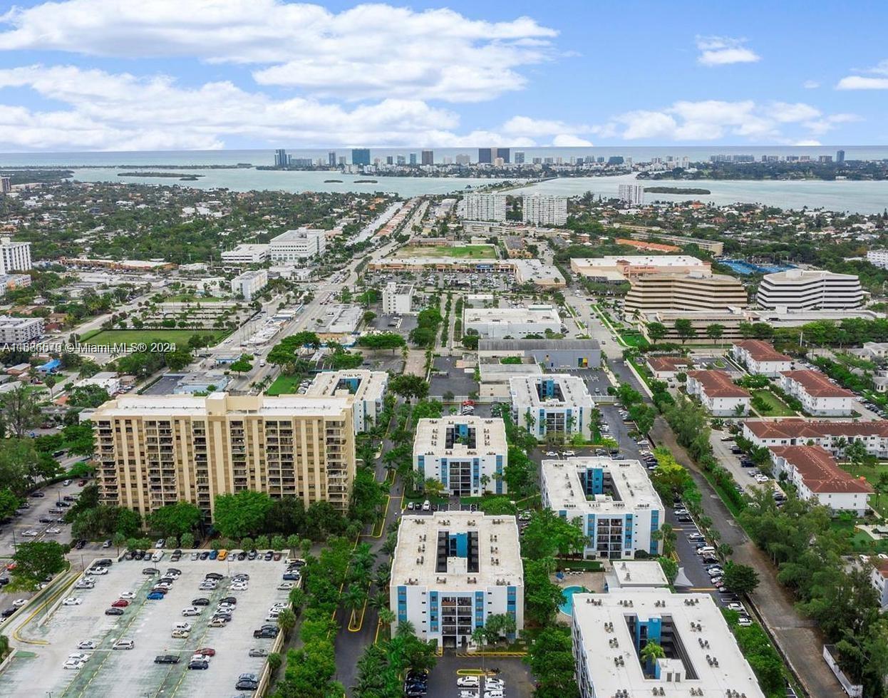 an aerial view of residential houses with city view