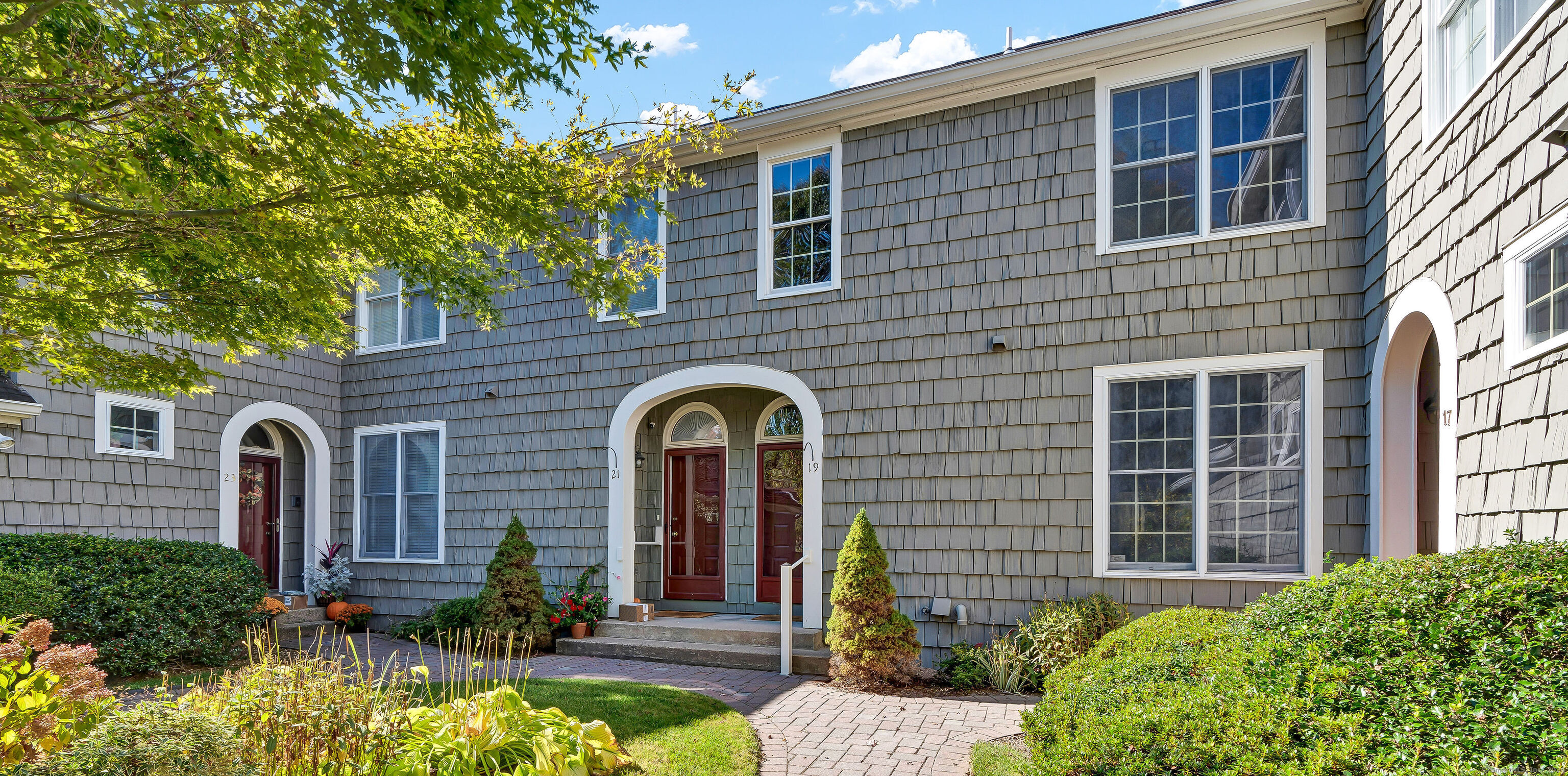 a front view of a house with garden