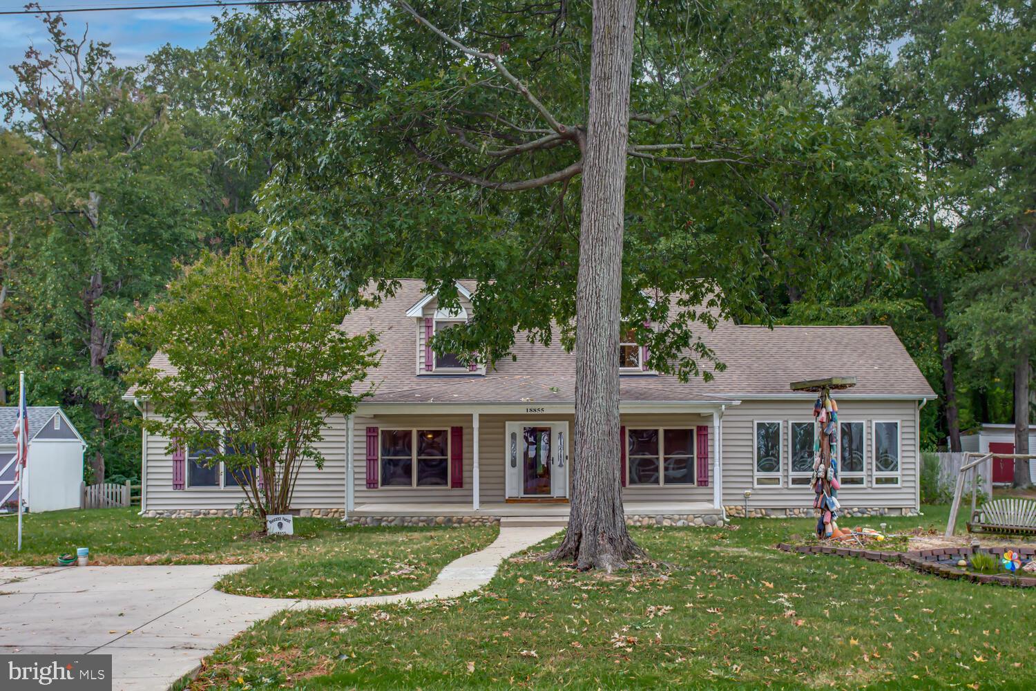 front view of a house with a garden