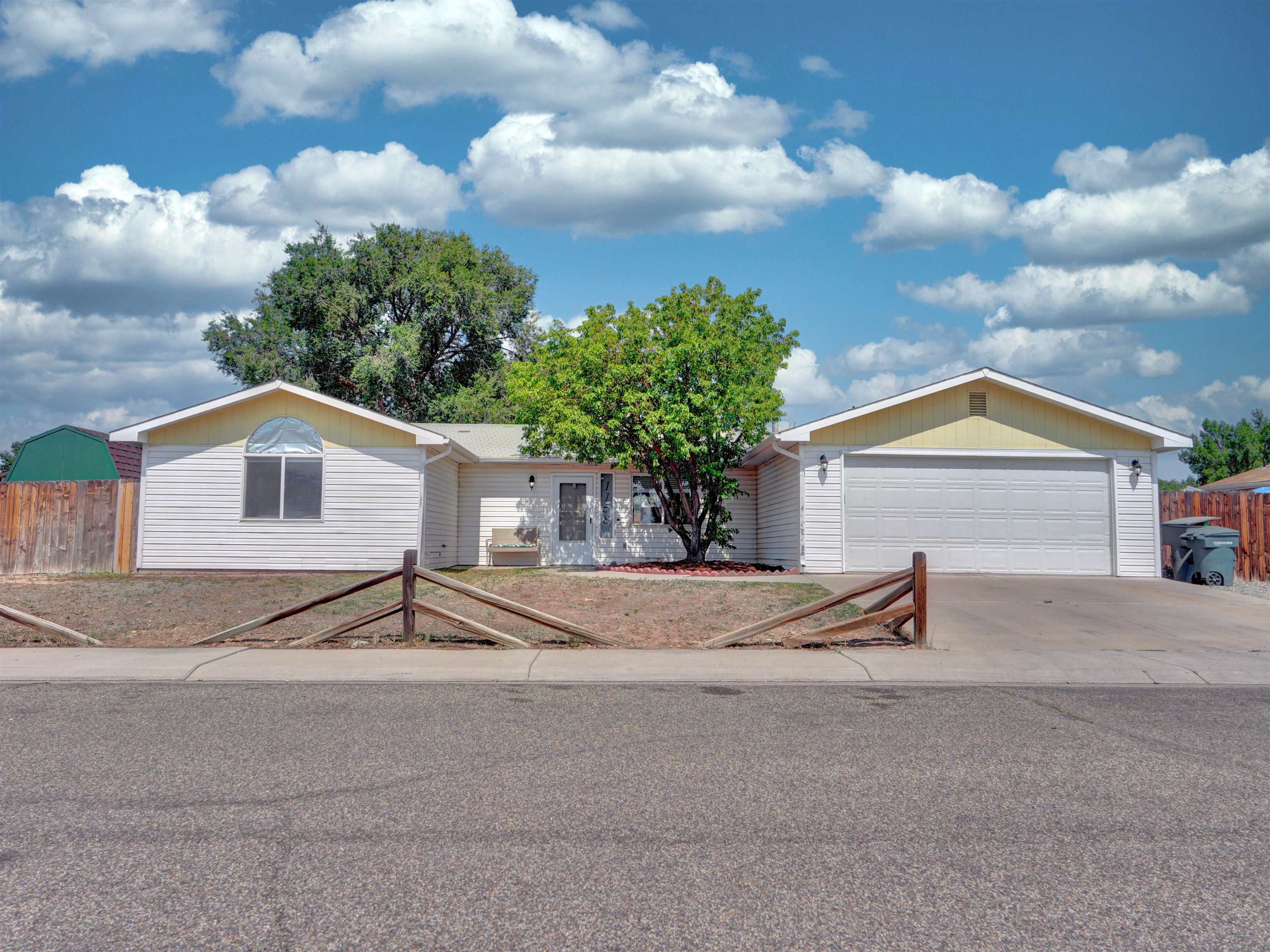 a house with trees in the background