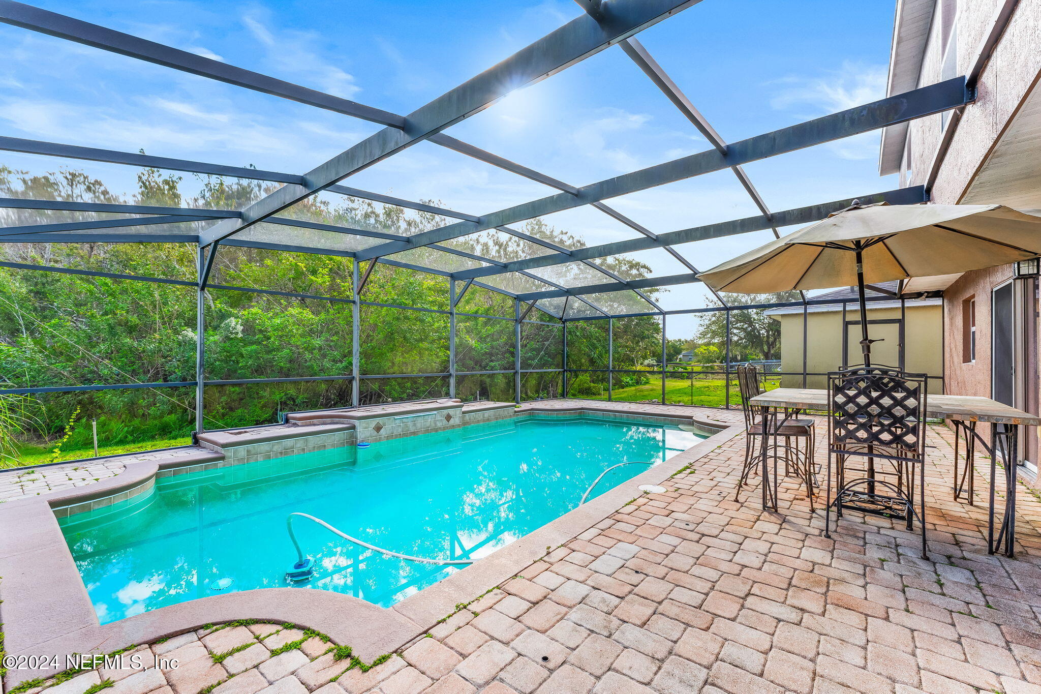 a view of a swimming pool with a patio