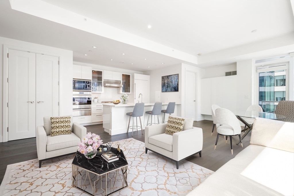 a living room with furniture and a table