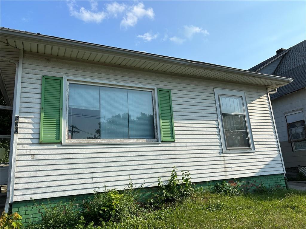 a view of a house with a small backyard