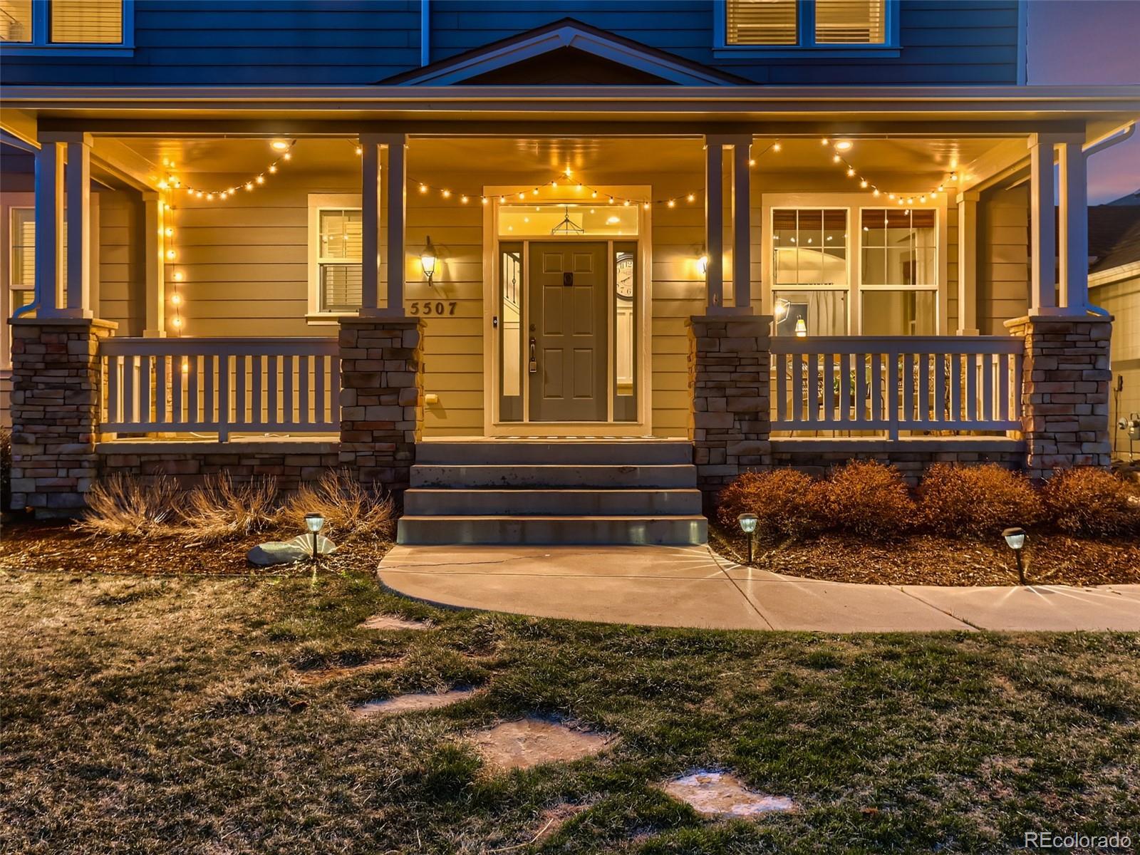 a view of a porch with a floor to ceiling window and wooden fence