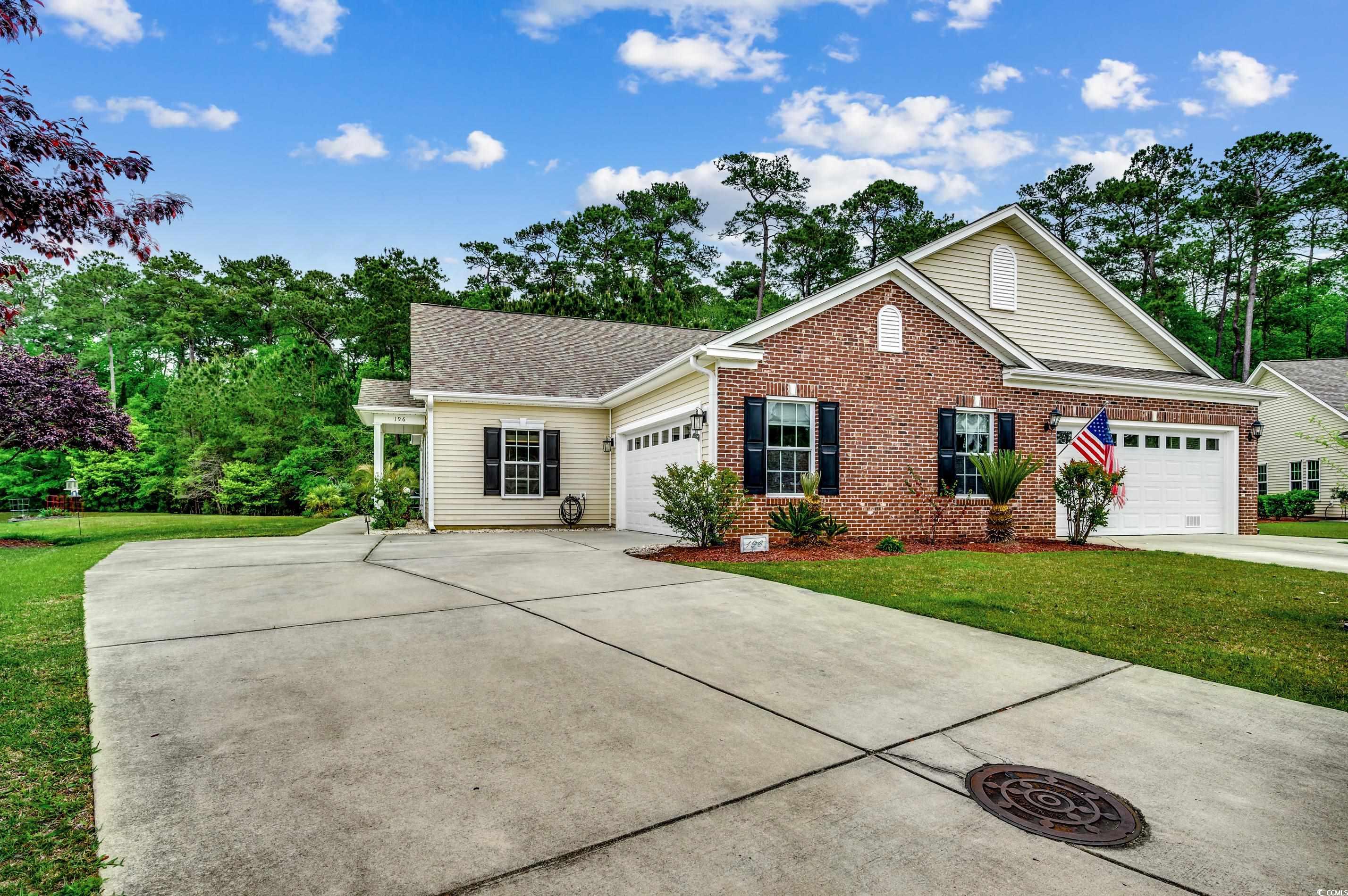 View of front of property with a front yard and a