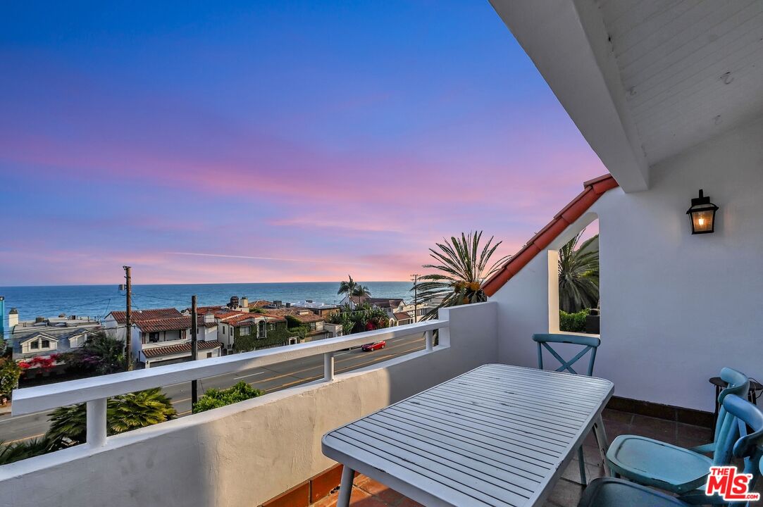 a view of a balcony with city view