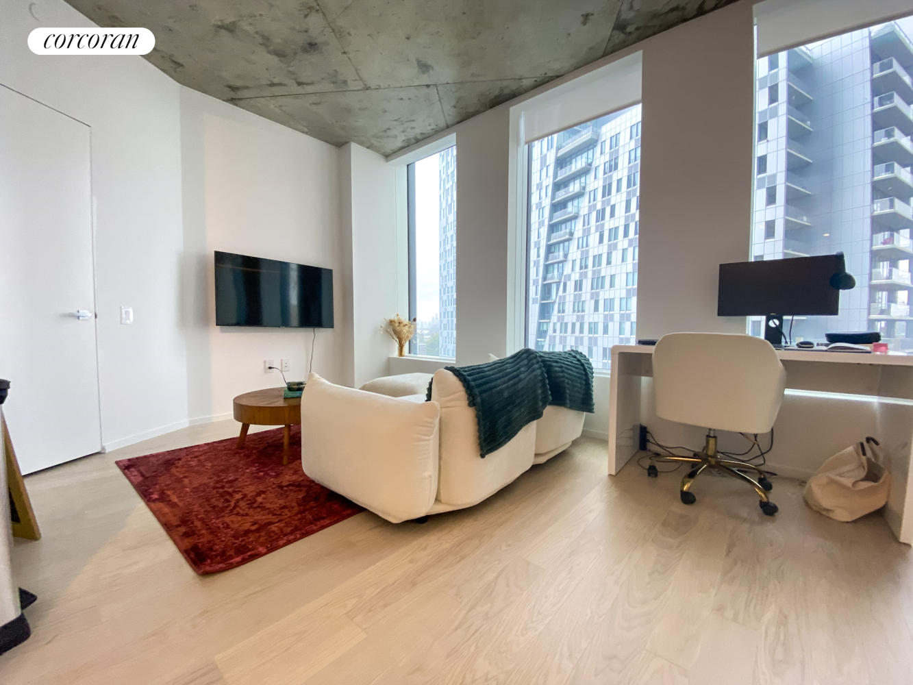 a living room with furniture and a flat screen tv