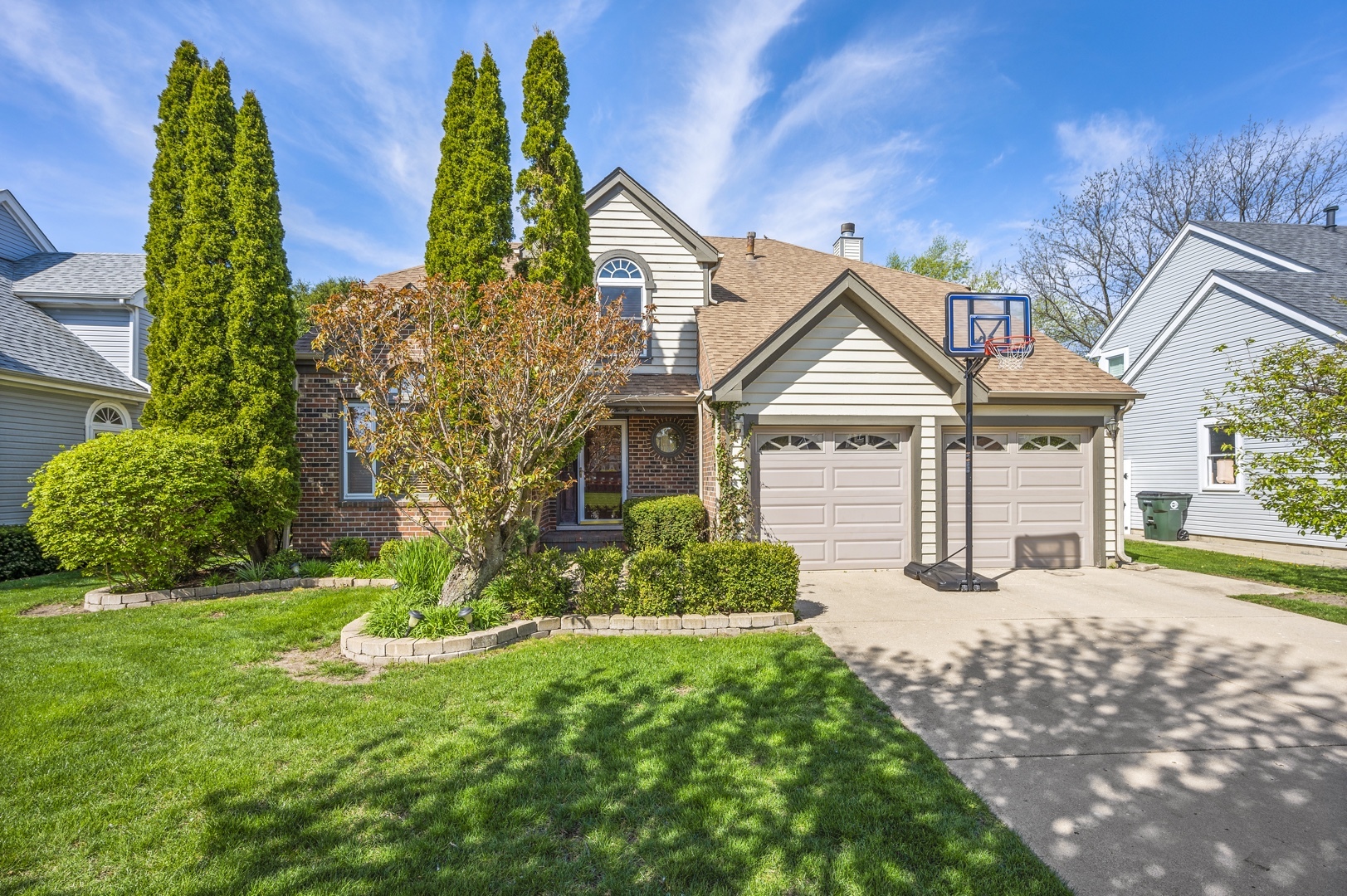 a front view of house with yard and green space