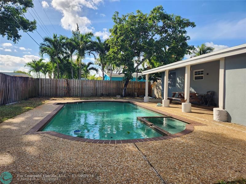 a view of a backyard with a garden and plants