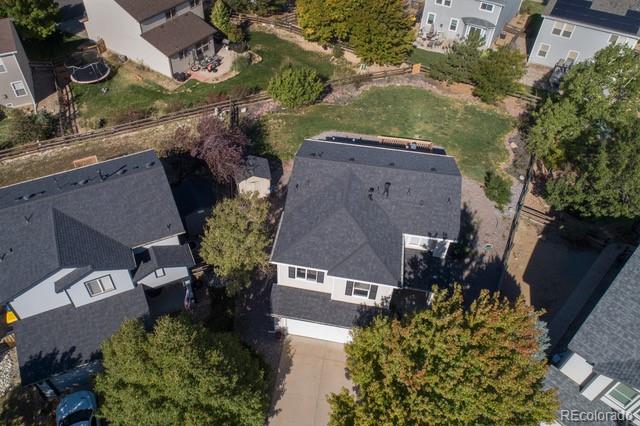 an aerial view of a house with a yard