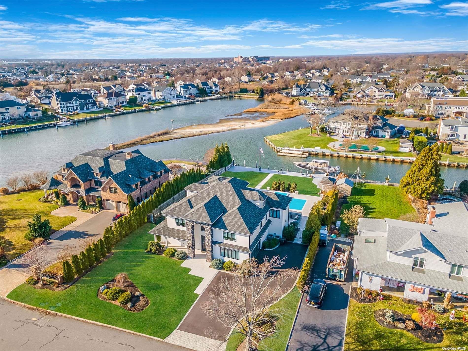 an aerial view of a house with a ocean view