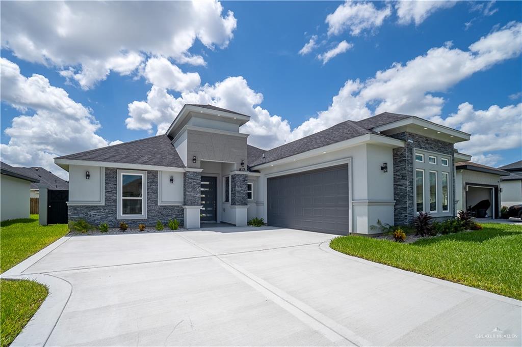 Prairie-style house with a garage