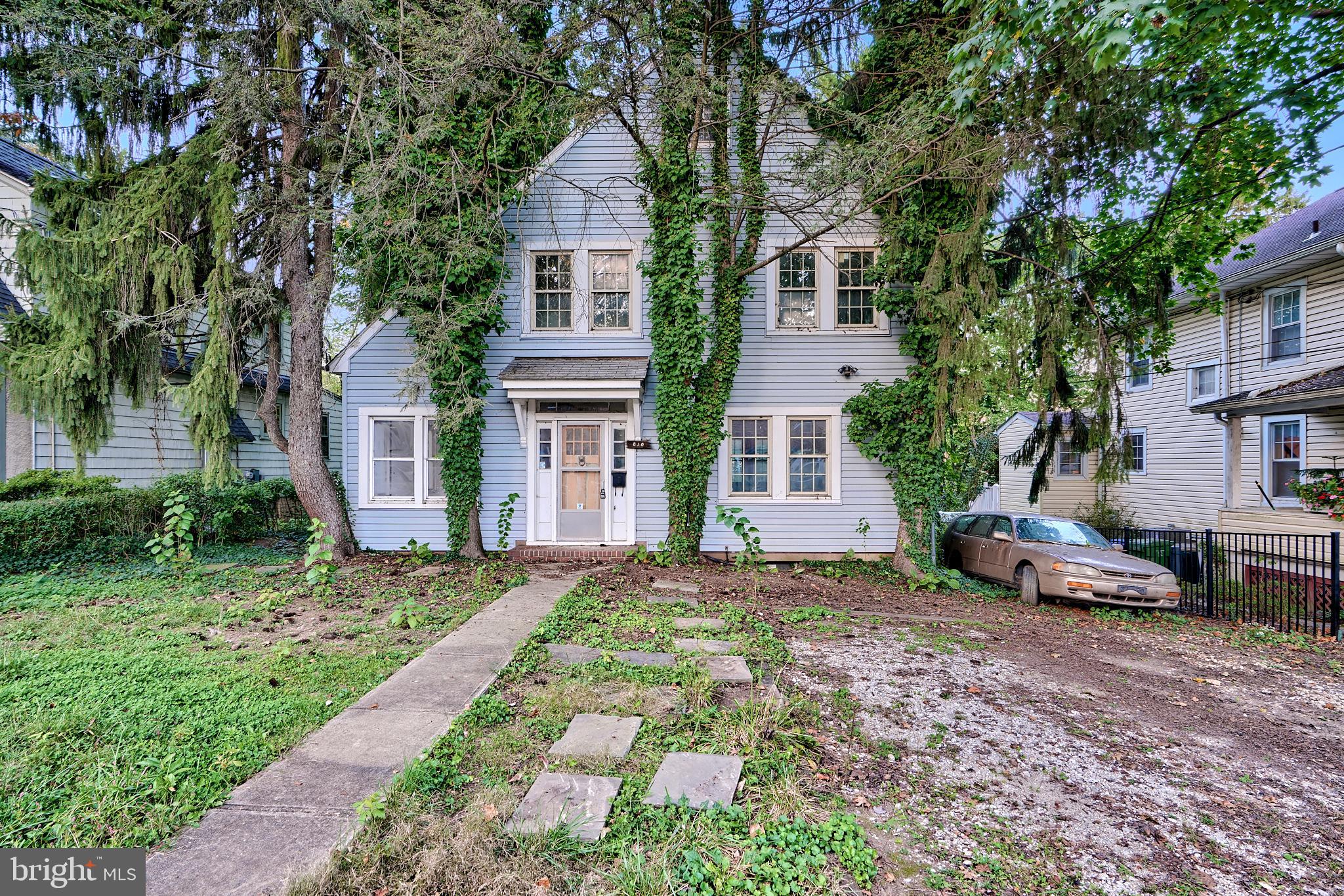 a view of a front of a house with a small yard