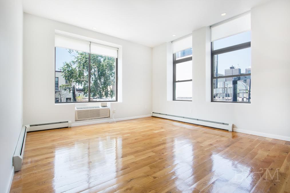 a view of an empty room with a window