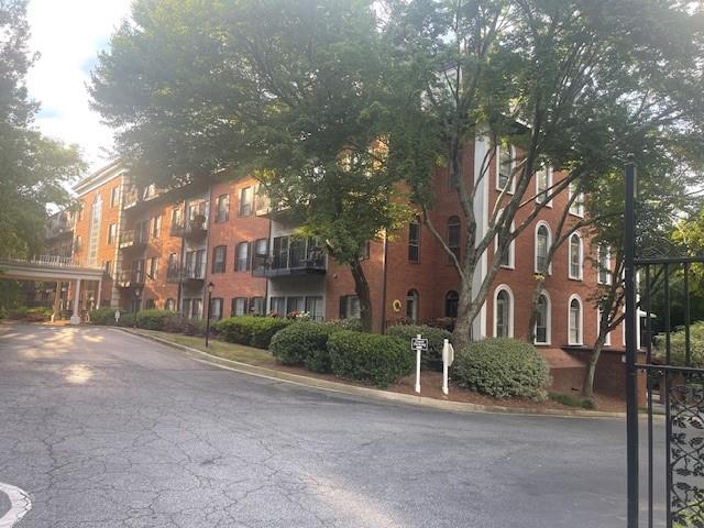 a view of a street with a building in the background