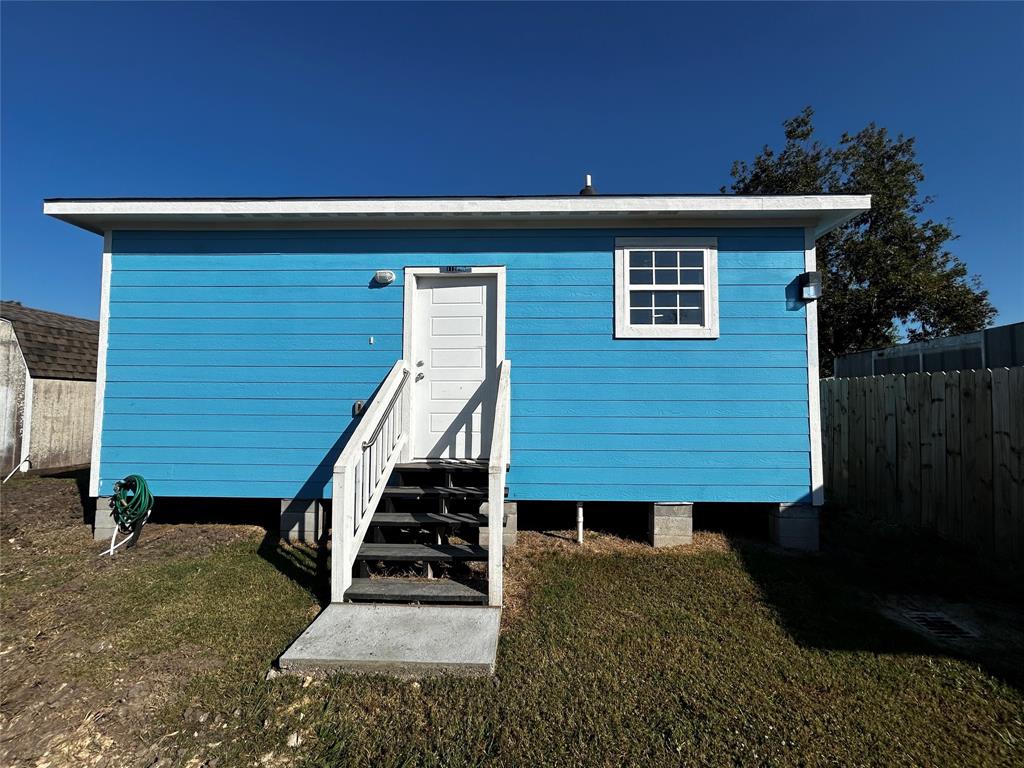 a view of backyard with small cabin