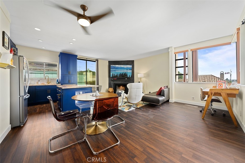 a living room with furniture a window and gym equipment