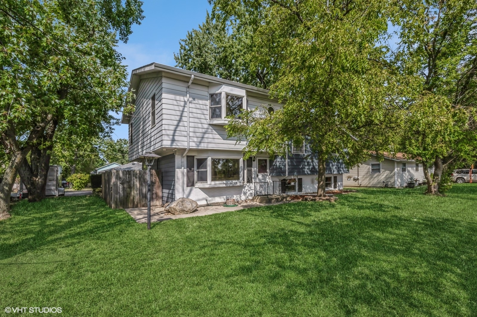 a front view of a house with a garden