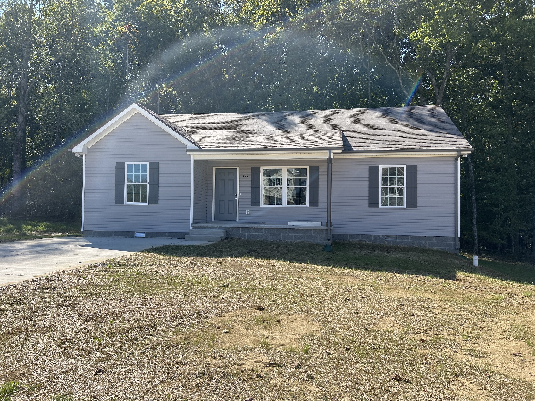 a house with trees in the background