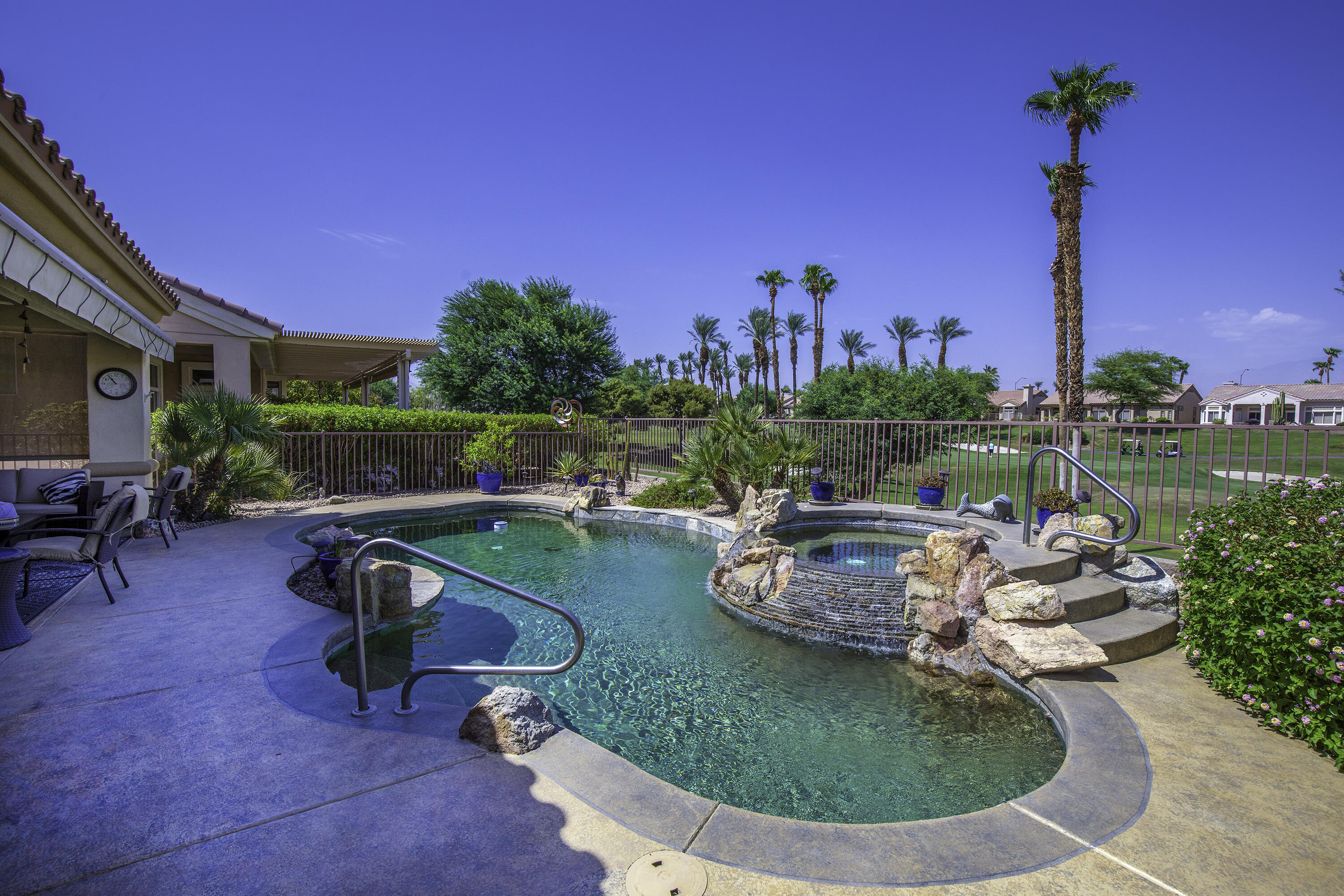 a view of a swimming pool with a patio