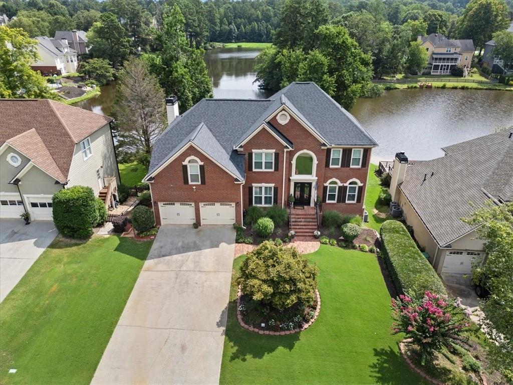 an aerial view of a house with a garden