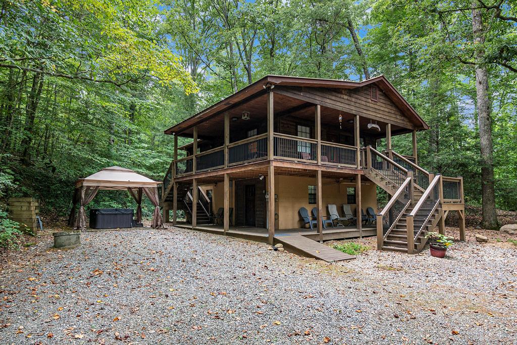 a view of a wooden deck and a yard