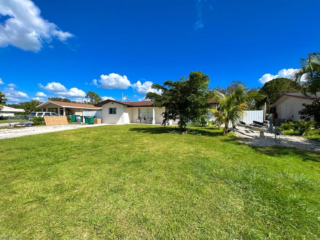 a view of a house with a big yard