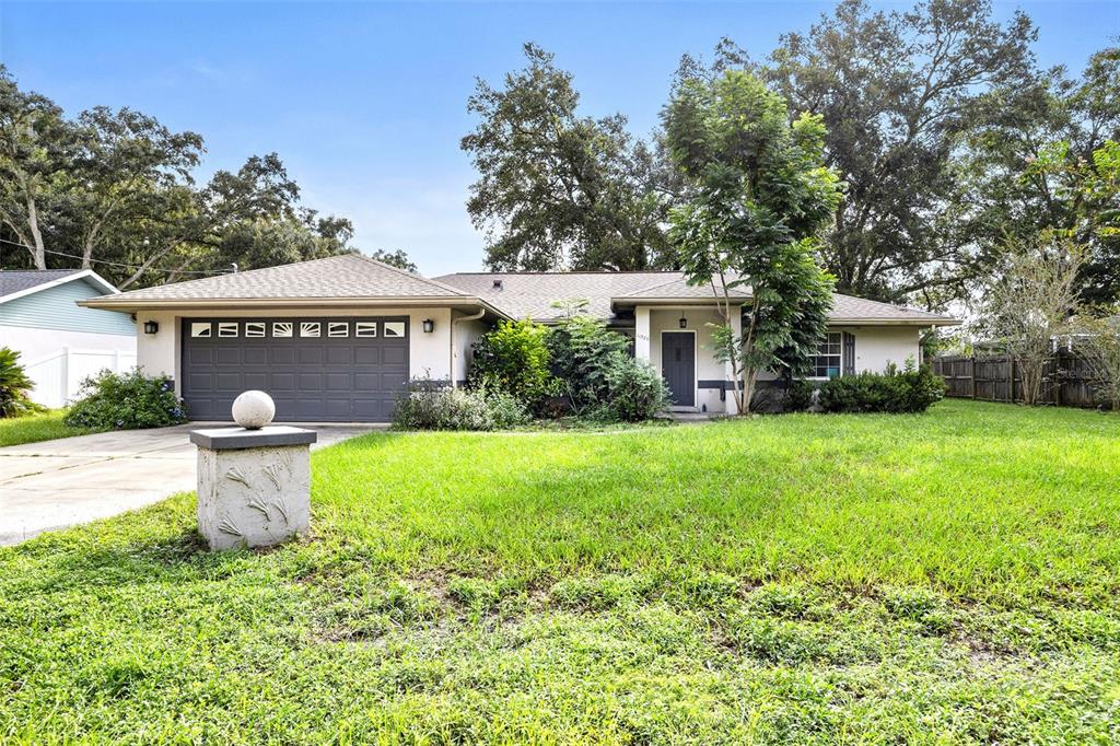 a front view of a house with garden