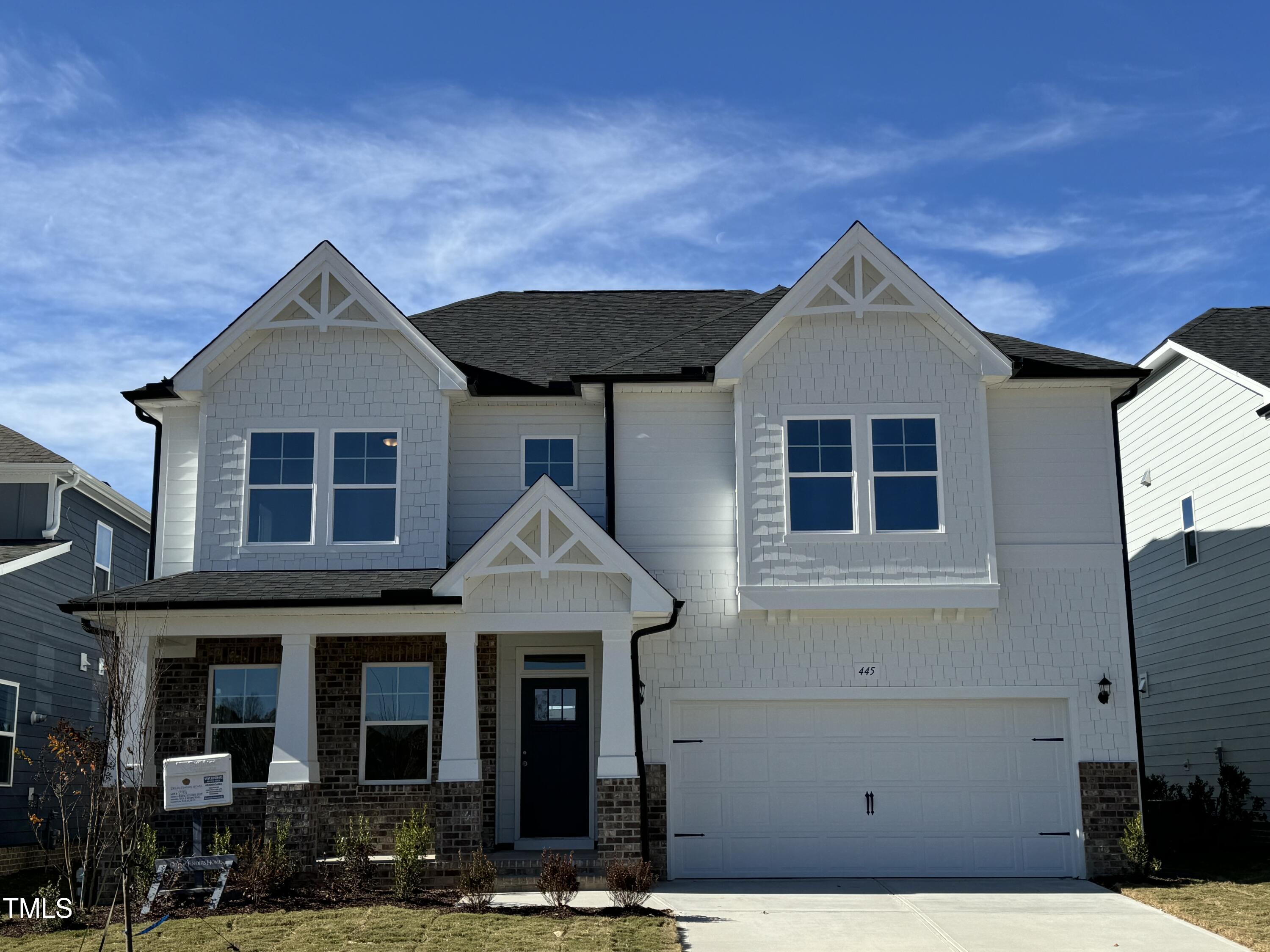 a front view of a house with yard