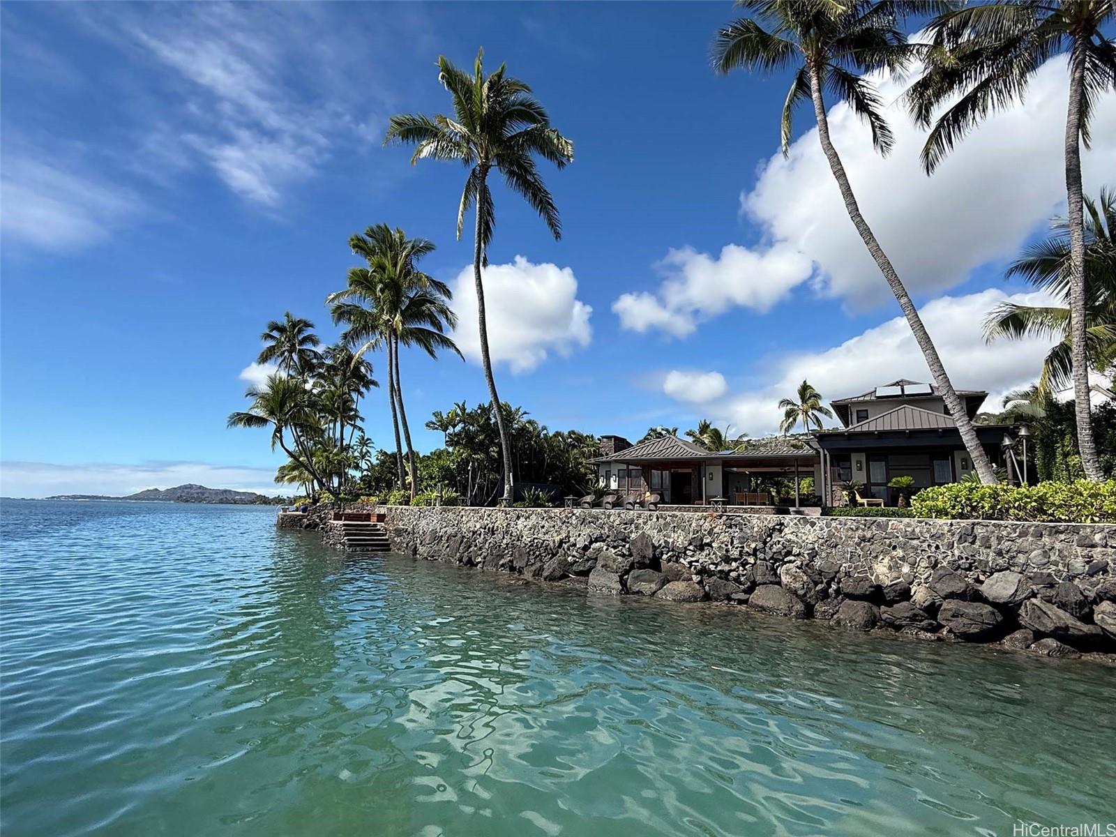 a view of an ocean with a house