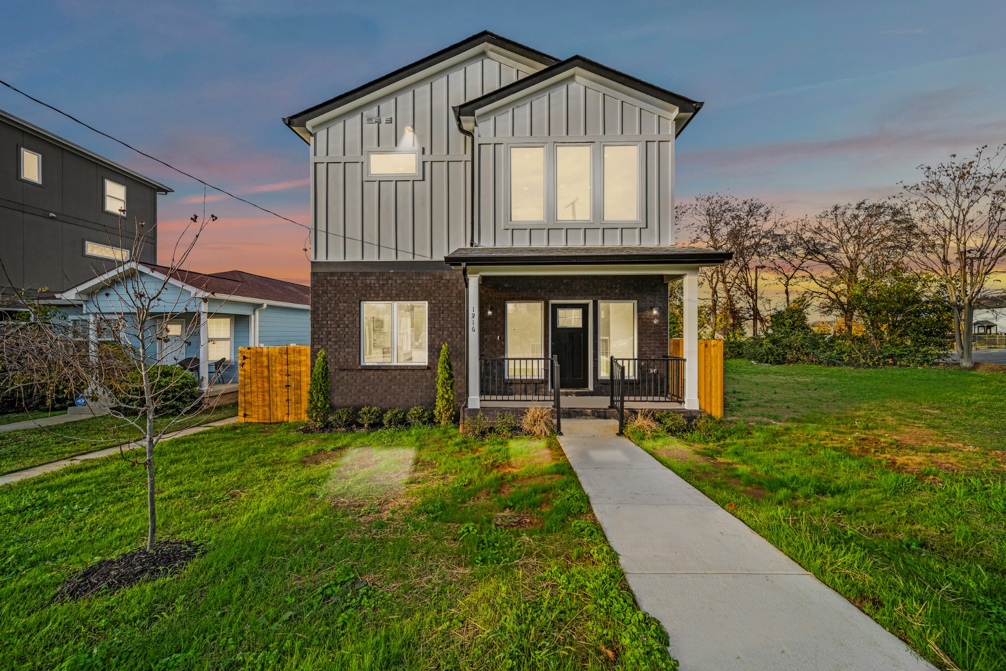 a front view of a house with a yard