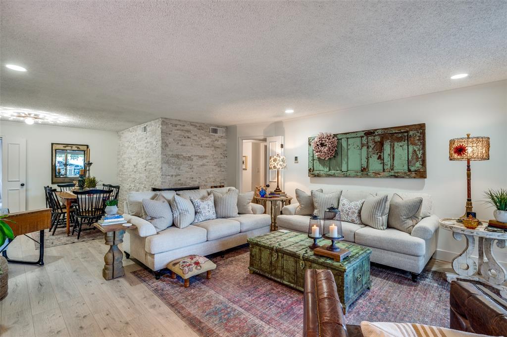 a living room with furniture and a rug