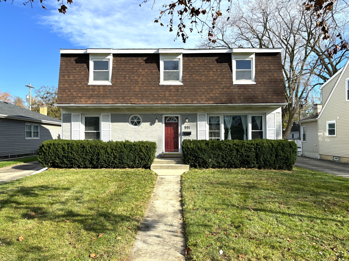 a front view of a house with a yard