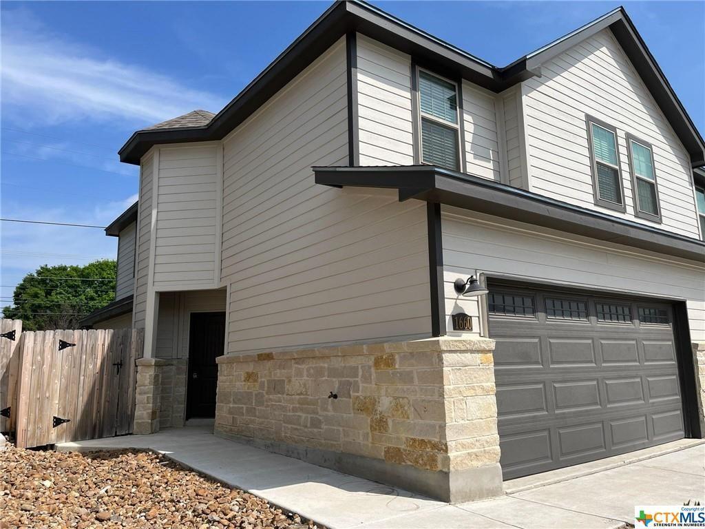 a front view of a house with a garage