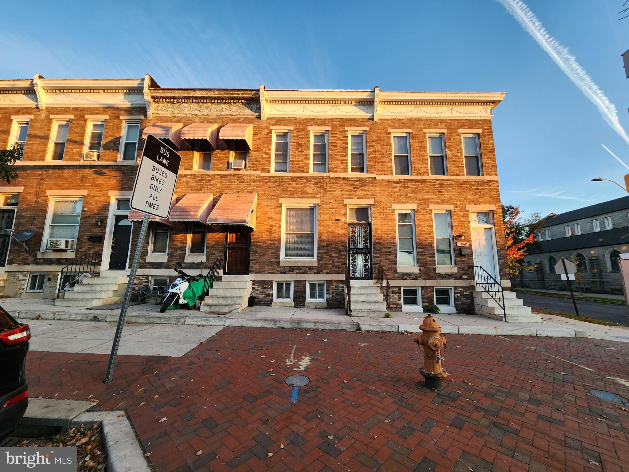 a front view of a building with street view