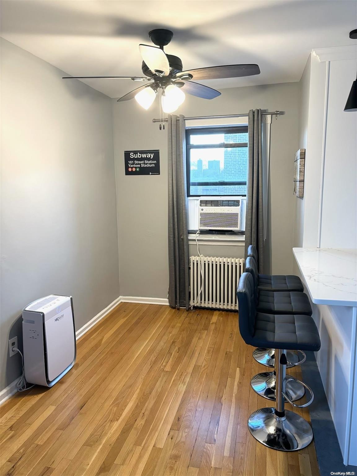 a bedroom with a bed and a lamp on desk