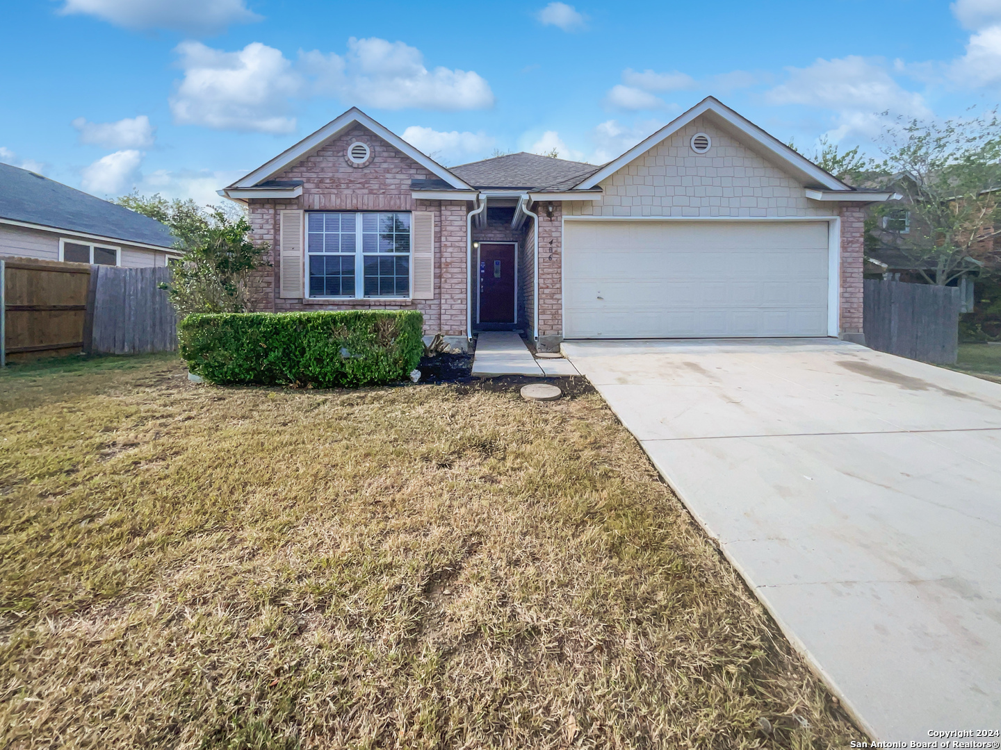 front view of a house with a yard