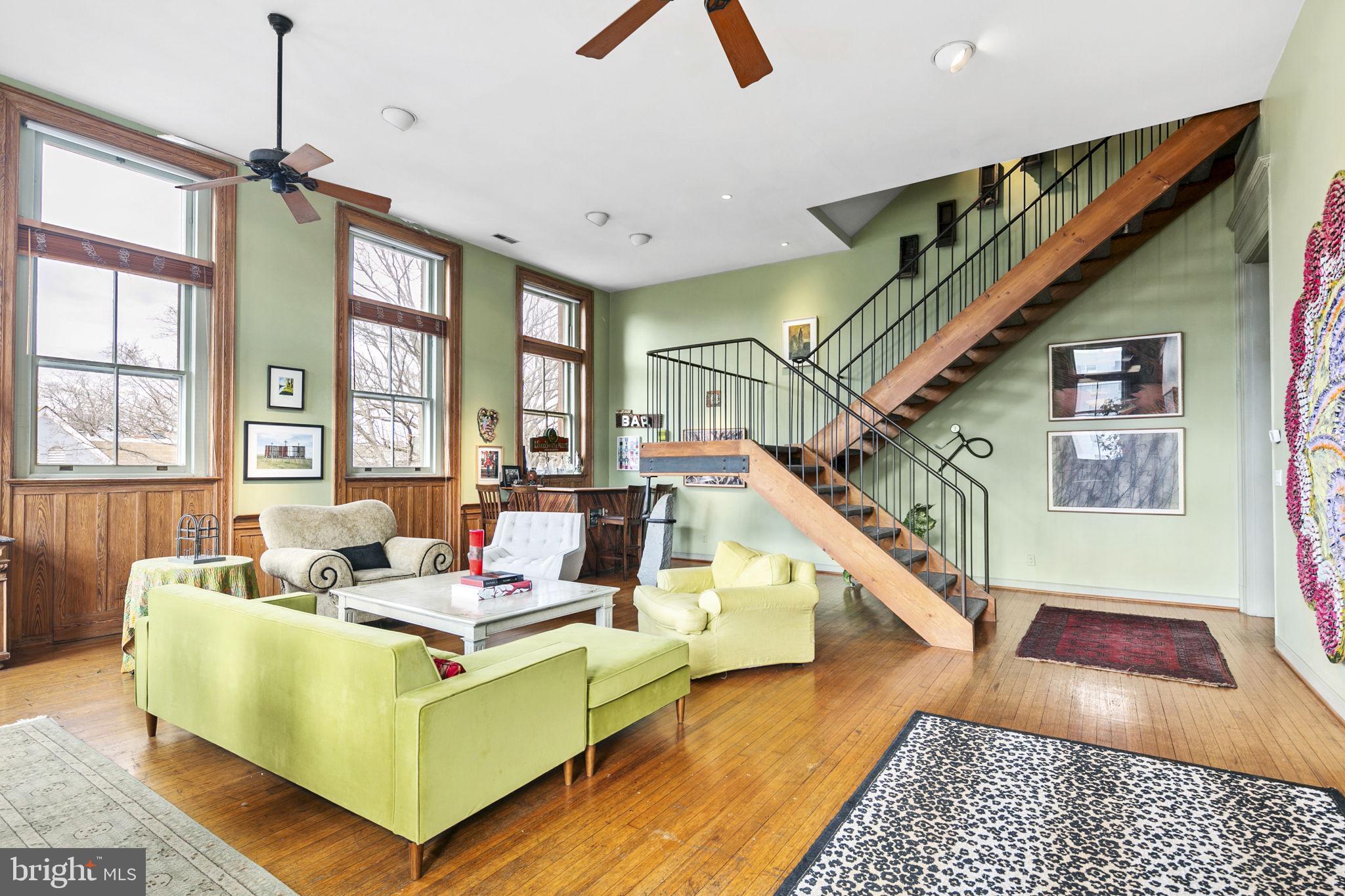 a living room with furniture and a rug