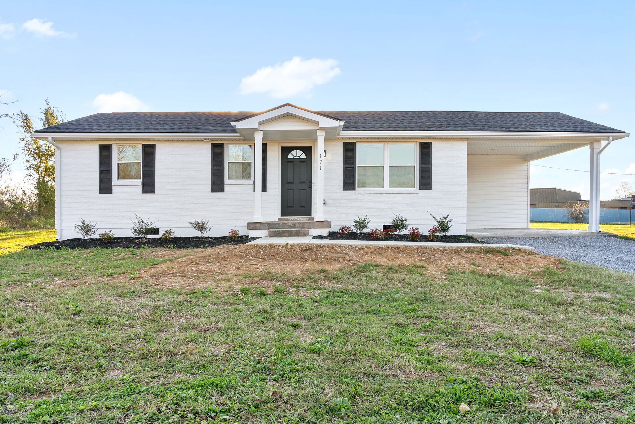 a front view of a house with a yard