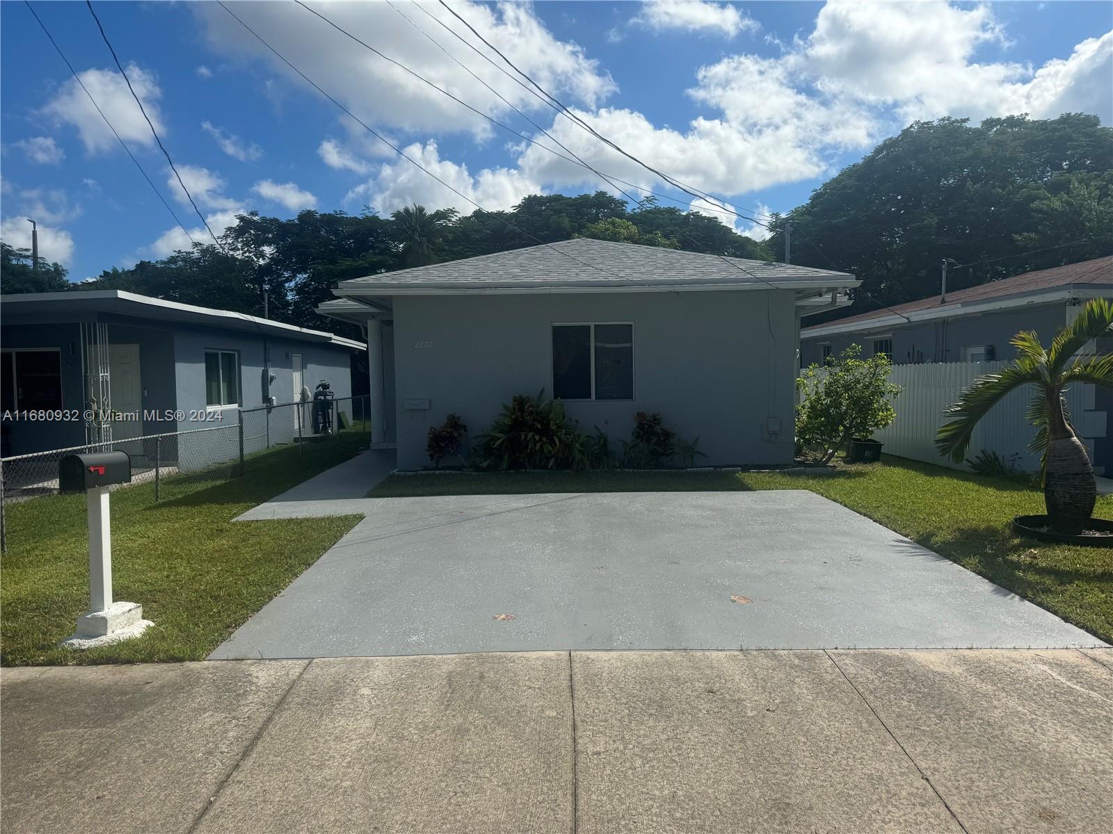 front view of house with a yard