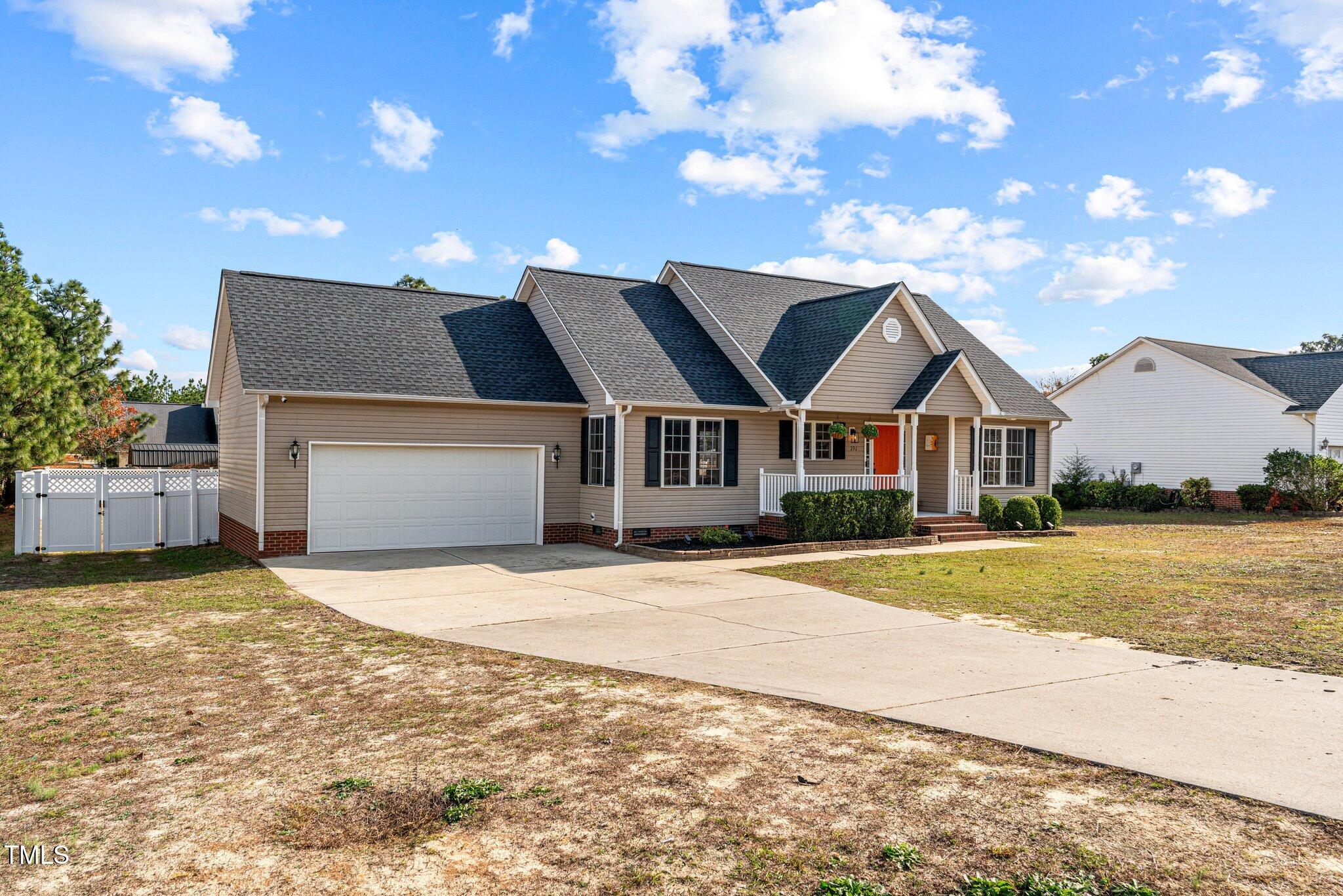 a front view of a house with yard