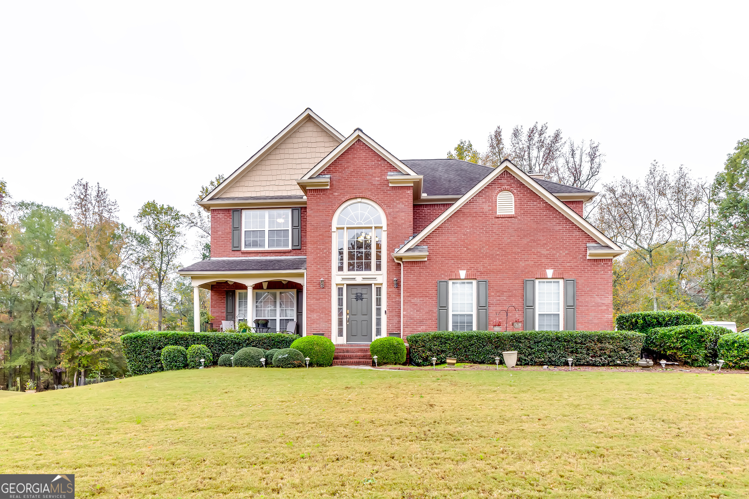 a front view of a house with a yard