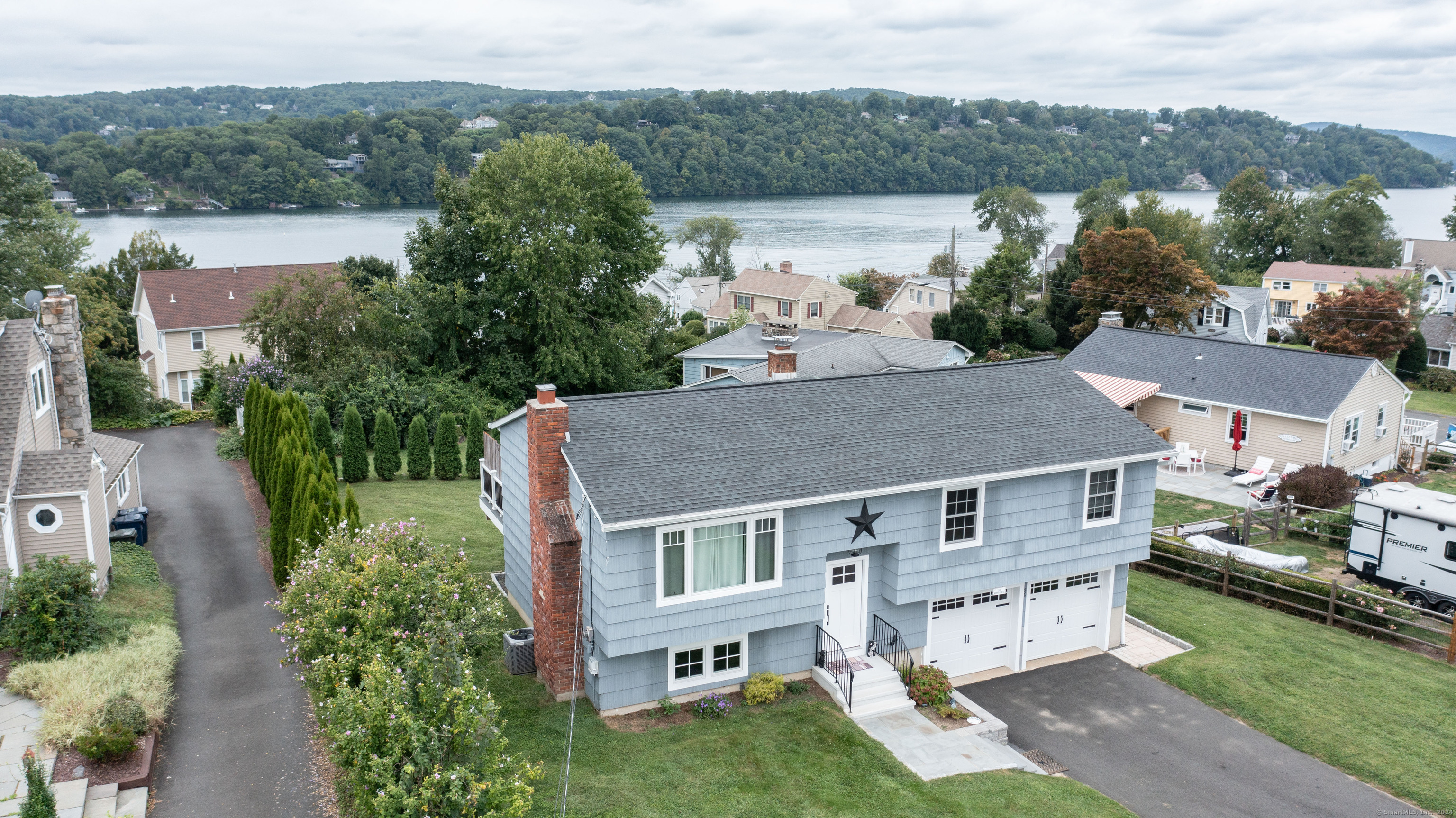 an aerial view of a house with a yard