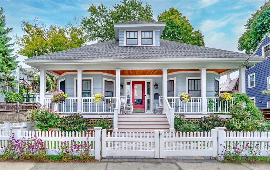 a house view with a garden and deck