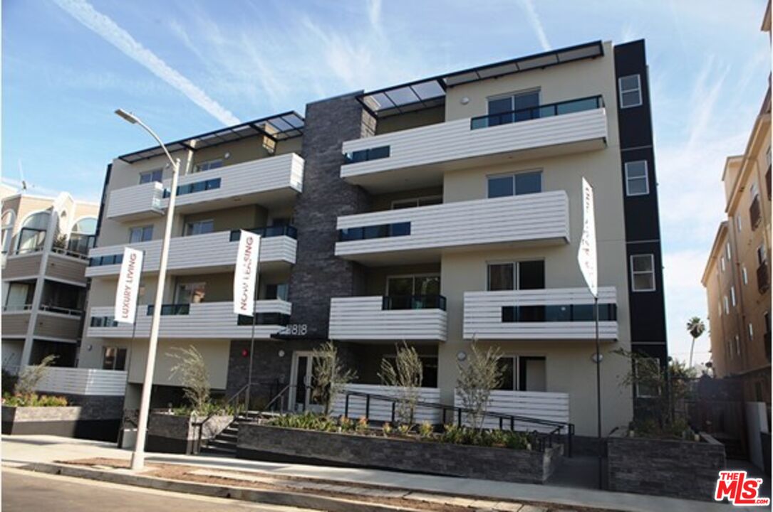 a front view of a building with street view