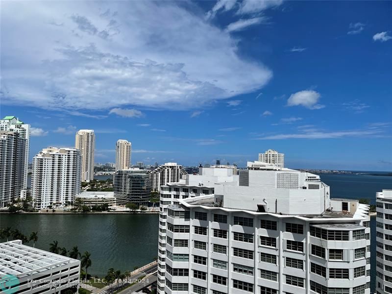 a view of a city with tall buildings