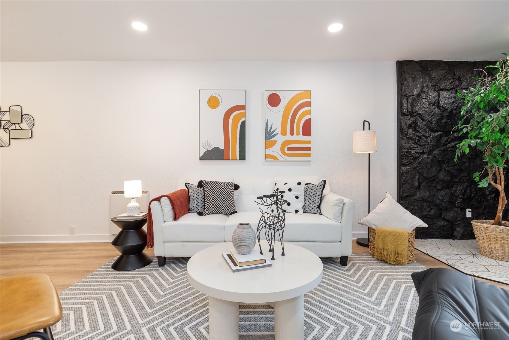 a living room with furniture and a table